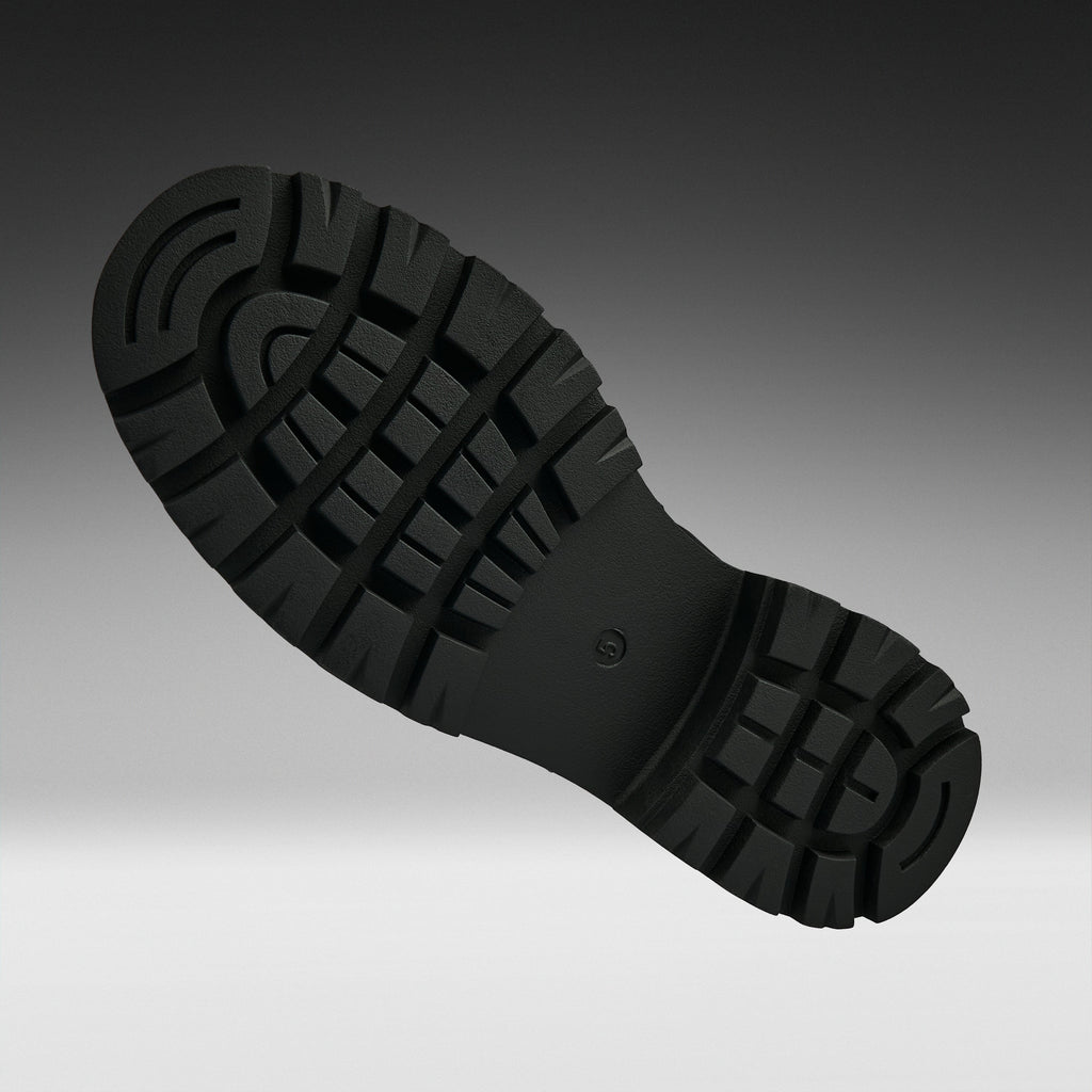 A close-up of a black rubber shoe sole with deep tread patterns, shown against a dark gray to light gray gradient background.