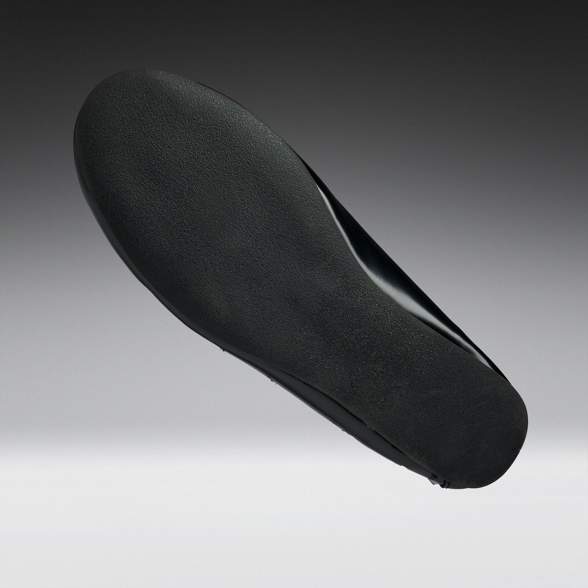 A black shoe insole shown floating against a gradient gray background.